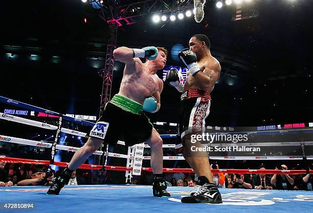 Canelo Alvarez of Mexico delivers a punch to James Kirkland during their super welterweight bout at Minute Maid Park on May 9, 2015 in Houston, Texas.