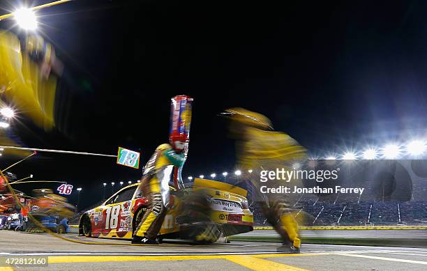 Erik Jones, driver of the M&M's Red Nose Day Toyota, pits during the NASCAR Sprint Cup Series SpongeBob SquarePants 400 at Kansas Speedway on May 9,...