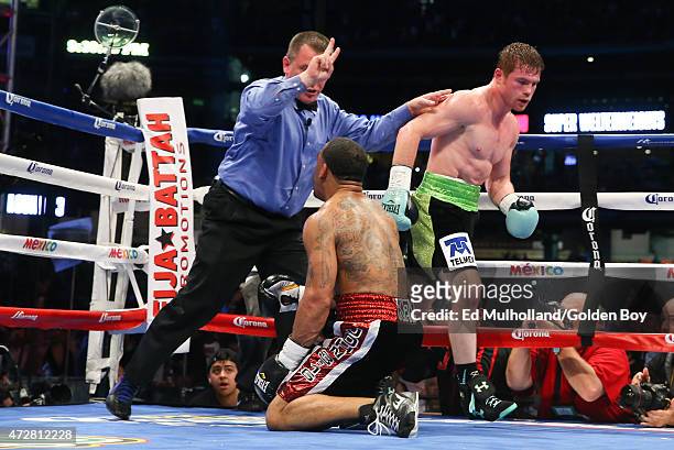 Saul "Canelo" Alvarez knocks down James Kirkland during their 12 round super welterweight fight at Minute Maid Park on May 9, 2015 in Houston, Texas.