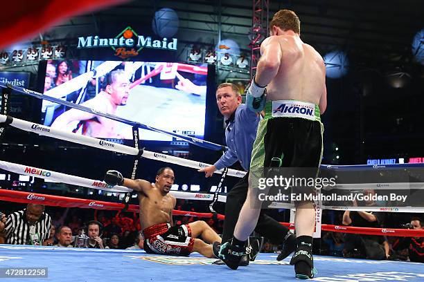 Saul "Canelo" Alvarez knocks down James Kirkland during their 12 round super welterweight fight at Minute Maid Park on May 9, 2015 in Houston, Texas.