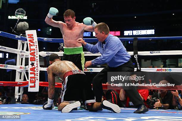 Saul "Canelo" Alvarez knocks down James Kirkland during their 12 round super welterweight fight at Minute Maid Park on May 9, 2015 in Houston, Texas.