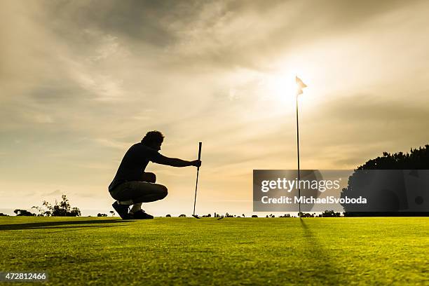 putter aiming - golf tournament stock pictures, royalty-free photos & images