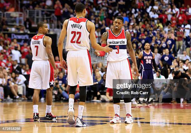 Bradley Beal and Otto Porter Jr. #22 of the Washington Wizards celebrate against the Atlanta Hawks during Game Three of the Eastern Conference...