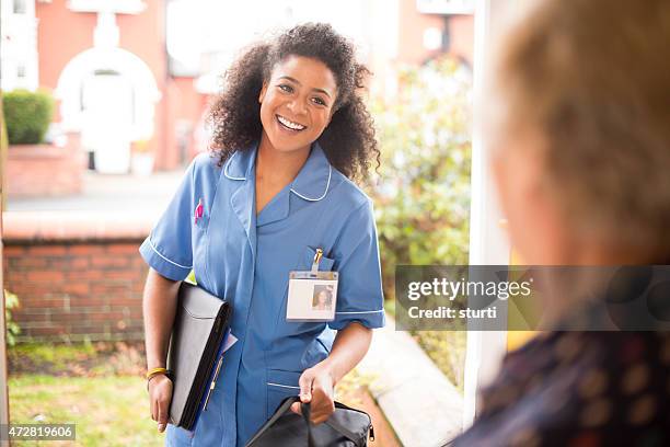 community carer  visit to senior - nurse leaving stock pictures, royalty-free photos & images