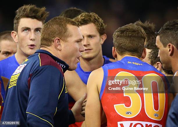 Justin Leppitsch the coach of the Lions talks to his players during the round six AFL match between the Carlton Blues and the Brisbane Lions at...