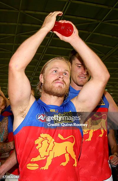 Daniel Rich of the Lions celebrates winning the round six AFL match between the Carlton Blues and the Brisbane Lions at Etihad Stadium on May 10,...