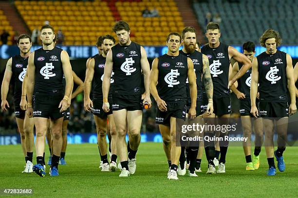 The Blues look dejected as they leave the field after losing the round six AFL match between the Carlton Blues and the Brisbane Lions at Etihad...