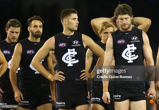 The Blues look dejected as they leave the field after losing the round six AFL match between the Carlton Blues and the Brisbane Lions at Etihad...