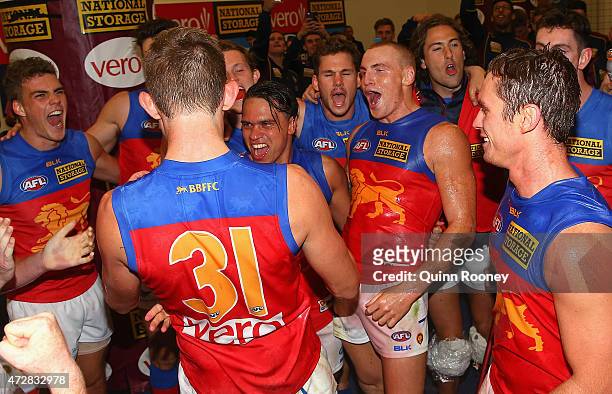 Harris Andrews, Allen Christensen, Mitch Robinson and Dayne Beams of the Lions sing the song in the rooms after winning the round six AFL match...