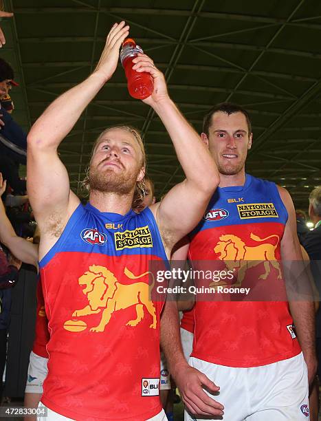 Daniel Rich of the Lions celebrates winning the round six AFL match between the Carlton Blues and the Brisbane Lions at Etihad Stadium on May 10,...