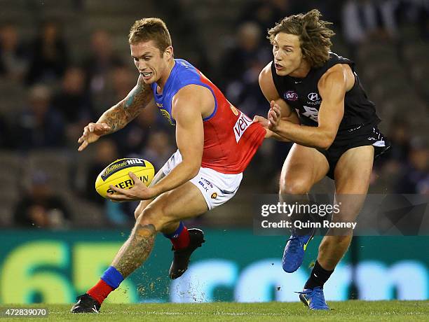 Dayne Beams of the Lions is tackled by Mark Whiley of the Blues during the round six AFL match between the Carlton Blues and the Brisbane Lions at...