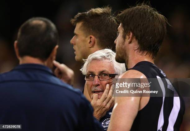 Mick Malthouse the coach of the Blues talks to his players on the boundary line during the round six AFL match between the Carlton Blues and the...