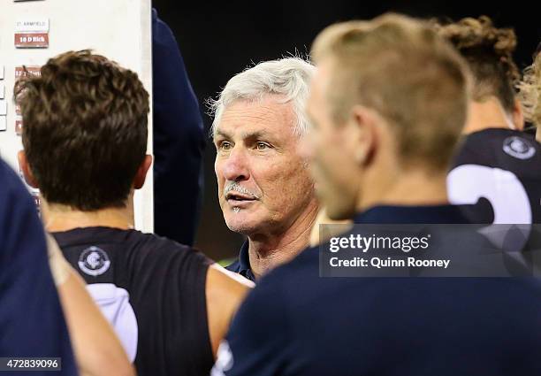 Mick Malthouse the coach of the Blues talks to his players during the round six AFL match between the Carlton Blues and the Brisbane Lions at Etihad...