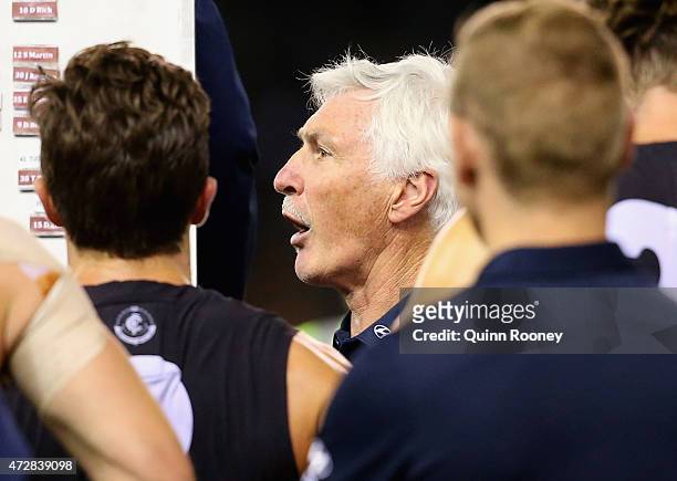 Mick Malthouse the coach of the Blues talks to his players during the round six AFL match between the Carlton Blues and the Brisbane Lions at Etihad...
