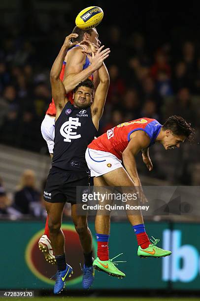 Matthew Leuenberger of the Lions and Clem Smith of the Blues compete for a mark during the round six AFL match between the Carlton Blues and the...