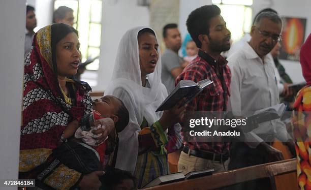 Pakistani Christians sing psalms as they attend special prayers for the victims of an army helicopter which was crashed in the northern mountainous...