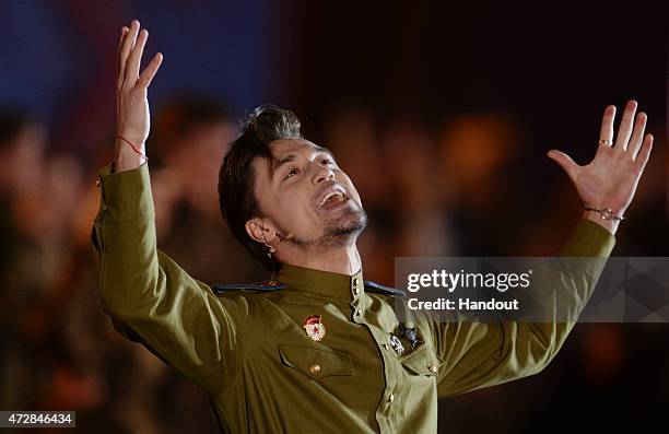 In this handout image supplied by Host photo agency / RIA Novosti, Singer Dima Bilan performs during the gala concert held in Red Square to mark the...