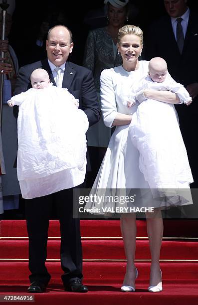 Prince Albert II of Monaco and his wife Princess Charlene pose outside the cathedral after the baptism of their twins Prince Jacques and Princess...