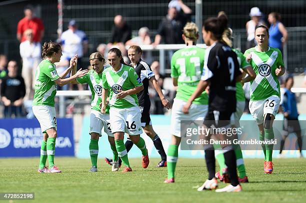 Martina Mueller of VfL Wolfsburg celebrates with team mates as she scores their first goal during the Allianz Frauen-Bundesliga match between 1. FFC...