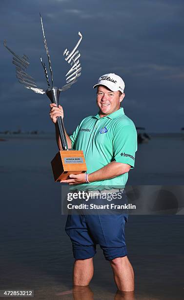 George Coetzee of South Africa with the trophy after winning the AfrAsia Bank Mauritius Open at Heritage Golf Club on May 10, 2015 in Bel Ombre,...