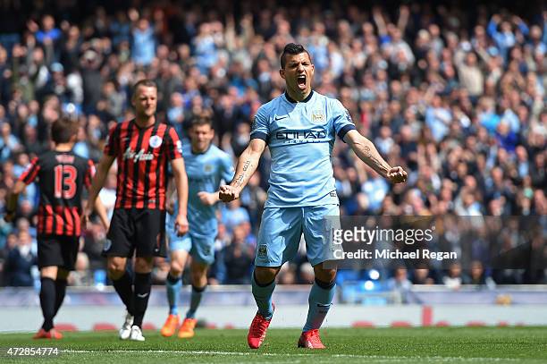 Sergio Aguero of Manchester City celebrates after scoring his team's fourth goal from the penalty spot during the Barclays Premier League match...