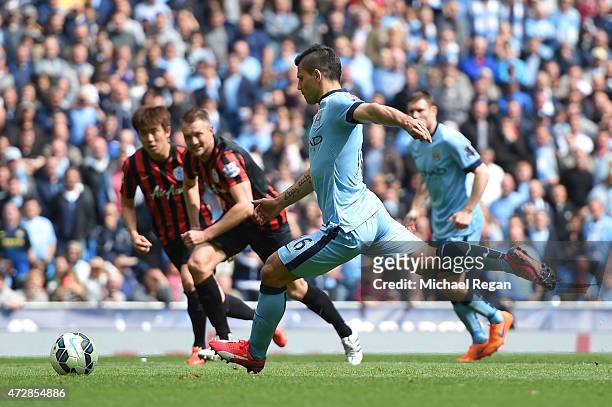 Sergio Aguero of Manchester City scores his team's fourth goal from the penalty spot during the Barclays Premier League match between Manchester City...