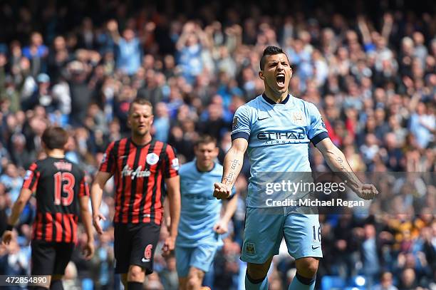 Sergio Aguero of Manchester City celebrates after scoring his team's fourth goal from the penalty spot during the Barclays Premier League match...