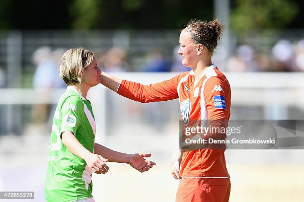 Martina Mueller of VfL Wolfsburg and team mate Almuth Schult react after the Allianz Frauen-Bundesliga match between 1. FFC Frankfurt and VfL...