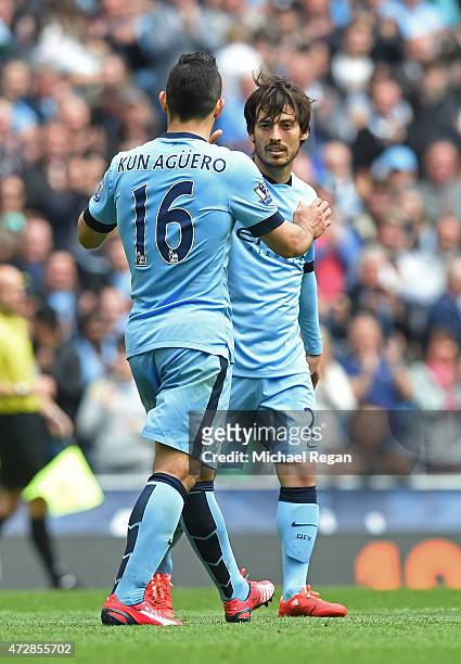 David Silva of Manchester City is congratulated by teammate Sergio Aguero of Manchester City after scoring his team's sixth goal during the Barclays...