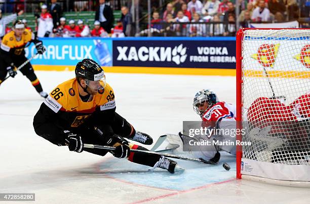 Daniel Pietta of Germany scores his team's opening goal over Ondrej Pavelec , goaltender of Czech Republic during the IIHF World Championship group A...