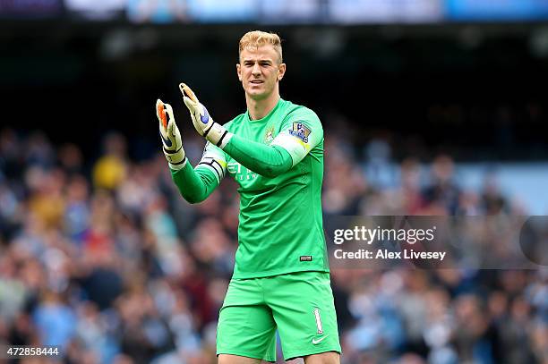 Joe Hart of Manchester City applauds the fans during the Barclays Premier League match between Manchester City and Queens Park Rangers at the Etihad...