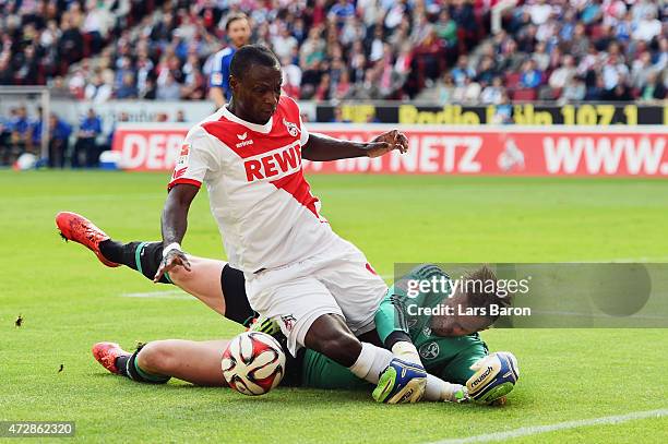 Anthony Ujah of Koeln is challenged by goalkeeper Ralf Faehrmann of Schalke during the Bundesliga match between 1. FC Koeln and FC Schalke 04 at...