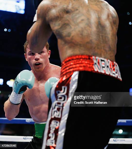 Canelo Alvarez of Mexico and James Kirkland box in the first round during their super welterweight bout at Minute Maid Park on May 9, 2015 in...