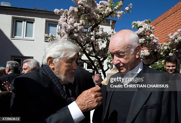 German actors Mario Adorf and Armin Mueller-Stahl attend a reception in the garden of the Guenter Grass House, which is dedicated German Nobel prize...