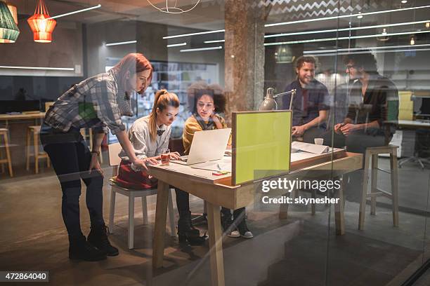 young team of creative people working in office. - hipster office stock pictures, royalty-free photos & images