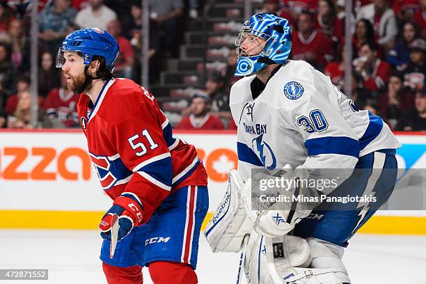 David Desharnais of the Montreal Canadiens stands near Ben Bishop in Game Five of the Eastern Conference Semifinals during the 2015 NHL Stanley Cup...