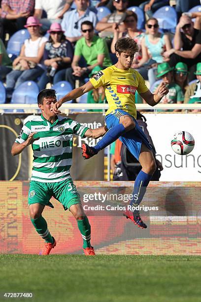 Estoril's midfielder Matias Cabrera vies with Sporting's defender Jonathan Silva during the Prmeira Liga match between Estoril and Sporting CP at...