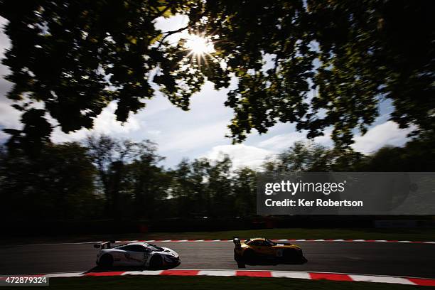 The Attempto Racing McLaren of Kevin Estre and Rob Bell follows he BMW Sports Trophy Team Brazil of Caca Bueno and Sergio Jimenez in the Main Race...