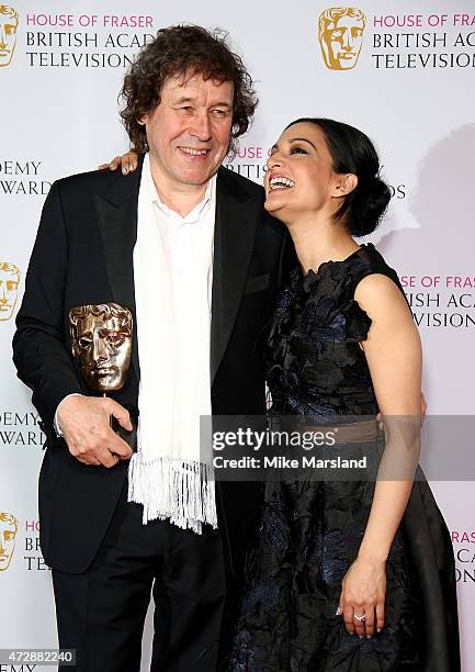 Archie Panjabi and Stephen Rea pose in the winners room with the Best Supporting Actor award at the House of Fraser British Academy Television Awards...