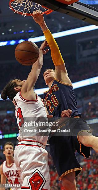 Timofey Mozgov of the Cleveland Cavaliers dunks over Joakim Noah of the Chicago Bulls in Game Four of the Eastern Conference Semifinals of the 2015...