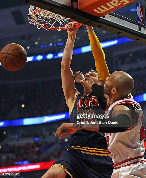 Timofey Mozgov of the Cleveland Cavaliers dunks over Taj Gibson of the Chicago Bulls in Game Four of the Eastern Conference Semifinals of the 2015...