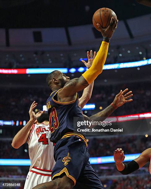 LeBron James of the Cleveland Cavaliers goes up for a shot past Nikola Mirotic of the Chicago Bulls n Game Four of the Eastern Conference Semifinals...