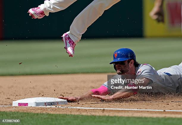 Kirk Nieuwenhuis of the New York Mets slides into third base in the sixth inning during a game against the Philadelphia Phillies at Citizens Bank...
