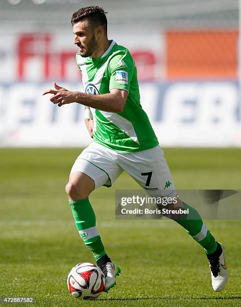 Daniel Caligiuri of Paderborn runs with the ball during the Bundesliga match between SC Paderborn and VfL Wolfsburg at Benteler Arena on May 10, 2015...