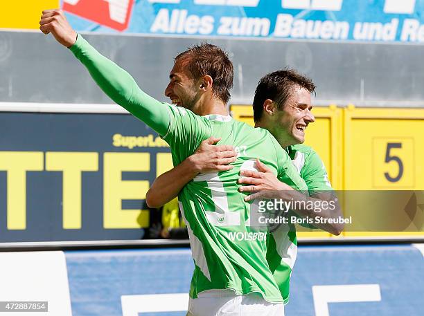 Bas Dost of Wolfsburg celebrates after scoring his team's second goal during the Bundesliga match between SC Paderborn and VfL Wolfsburg at Benteler...