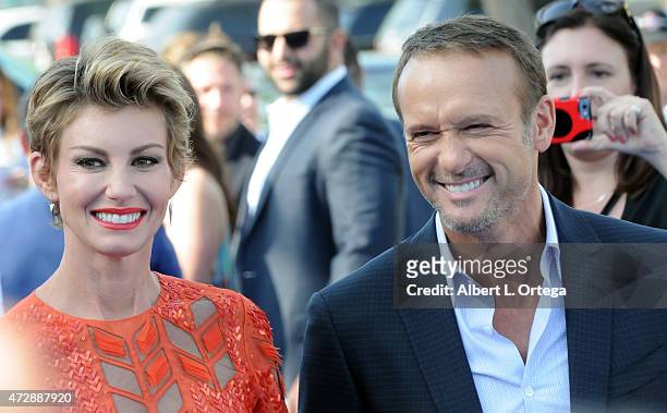 Singer Faith Hill and actor/Country singer Tim McGraw arrive for the Premiere Of Disney's "Tomorrowland" held at AMC Downtown Disney 12 Theater on...
