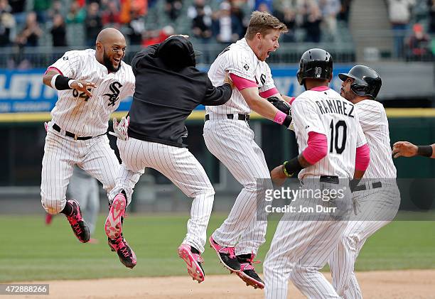 Gordon Beckham of the Chicago White Sox and the team celebrate after he hit the game winning RBI against the Cincinnati Reds during the ninth inning...