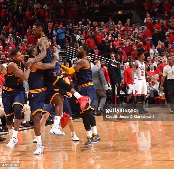 LeBron James of the Cleveland Cavaliers celebrates with his teammates after hitting the game winning shot with .7 seconds left in the game against...