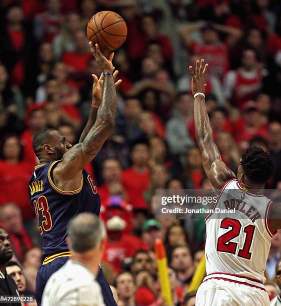 LeBron James of the Cleveland Cavaliers shoots the game-winning, two point shot over Jimmy Butler of the Chicago Bulls in Game Four of the Eastern...