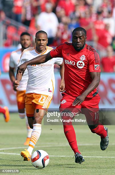 Jozy Altidore of Toronto FC gets past Ricardo Clark of the Houston Dynamo during an MLS soccer game between the Houston Dynamo and Toronto FC at BMO...